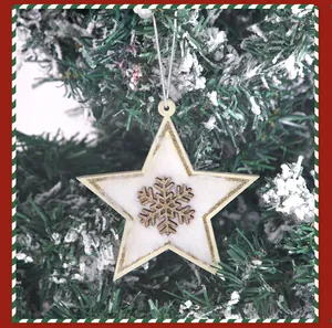 Close-up of a wooden plush star Christmas ornament with a snowflake cutout detail