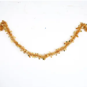 Macro view of 2m gold star tinsel garland for Christmas and party decorations.