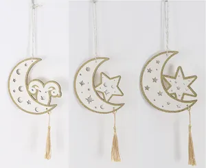 Three variations of wooden moon pendants with stars and tassels for Eid decorations