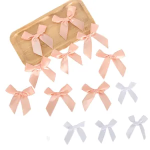 Mini fiocchi in nastro di raso rosa e bianco per decorazioni di feste e artigianato