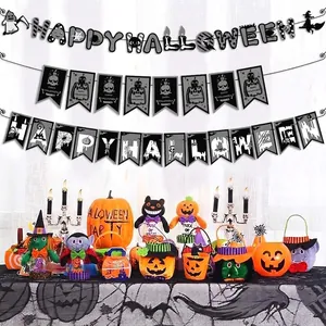 Extensive set of Halloween party decorations including banners, pumpkin bags, and plush toys