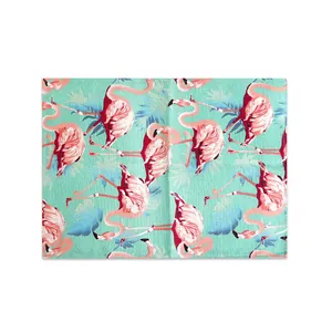 Detailed macro view of tropical flamingo print on a linen texture fabric placemat