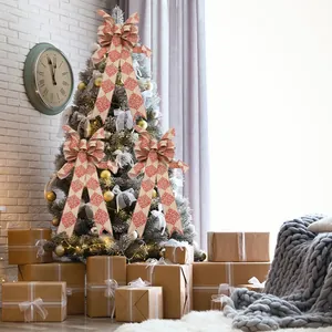 Large handmade pink burlap Christmas bows for tree decoration with red floral pattern