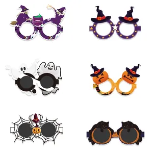Six pairs of colorful Halloween paper glasses with witch, ghost, and pumpkin designs
