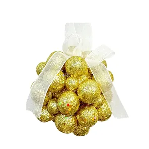 Gold glitter foam ball Christmas ornament cluster with elegant white chiffon ribbon bow