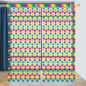 Close-up of rainbow gradient smiley face curtain for party background decoration.