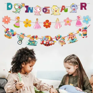 Display of cartoon party banners with dinosaurs and princesses in a kids room setting