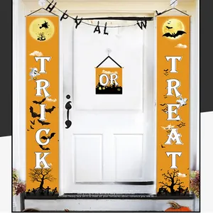 Detail of orange Halloween Trick or Treat door banners and hanging decorations