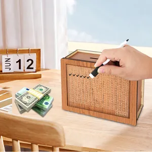 Detail of wooden money box showing counter grid being marked with a white pen