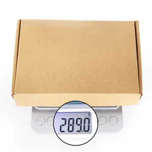 Detail showing creative wooden money box weighing 289 grams on a digital scale.