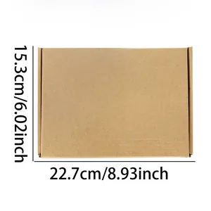 Close-up detail showing dimensions of the brown cardboard money box: 22.7cm by 15.3cm.