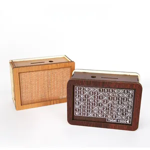 Handmade wooden money box featuring a savings counter grid with a 1000 Euro target goal