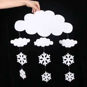 Detail view of white foam cloud and snowflake pendant for Christmas ceiling decor