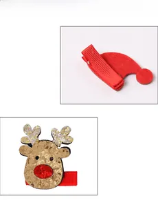 Close-up detail view of sequined reindeer and red felt hat Christmas hair clips for kids