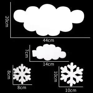 Macro view of white foam Christmas ornaments showing dimensions of clouds and snowflakes