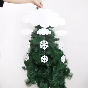 Close-up of white foam cloud and snowflake ornaments for hanging Christmas tree decoration