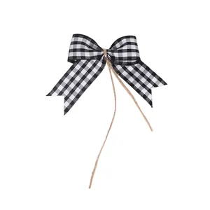 Detailed view of a black and white checkered DIY bow for Christmas tree decoration.