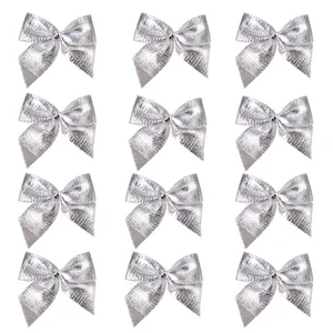 Set of 12 small silver Christmas bows for festive tree decoration and DIY gift wrapping