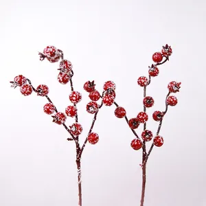 Frosted artificial red berries on stems for DIY Christmas tree decoration and photography