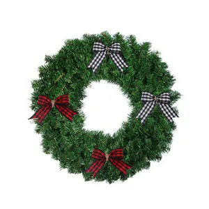 Classic artificial green Christmas wreath with red and black buffalo plaid bows