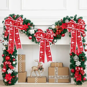 Set of 3 red burlap Christmas bows with reindeer and tree prints for holiday home decor.