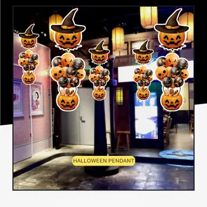 Detailed view of Halloween paper pendants with pumpkin faces and witch hats decoration