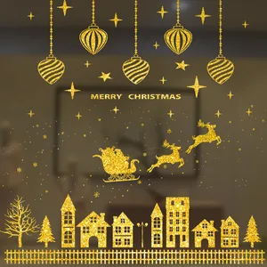 Festive gold glitter Christmas window stickers with Santa sleigh, reindeer, and winter houses