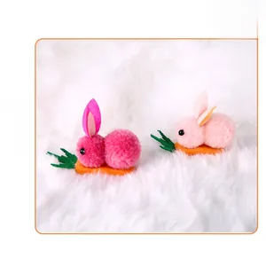 Side view of plush Easter bunny hair clips on felt carrots with a soft white fur background.