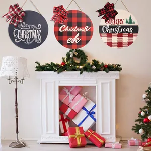 Three decorative round wooden Christmas signs with festive bows for holiday home decor.