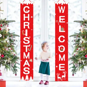Macro view of red Christmas welcome banners with festive reindeer and Santa patterns