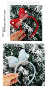 Close-up of red and light blue Christmas bow headbands with snowflake and pompom details.