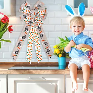 Large festive Easter bow featuring black-and-white bunny and carrot patterns for door hanging.
