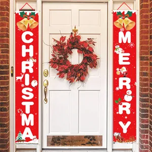 Festive Christmas door banners hanging on a white front door for holiday decor