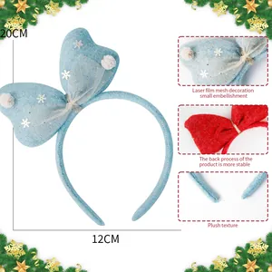 Festive light blue plush Christmas bow headband with mesh snowflakes and size markings.