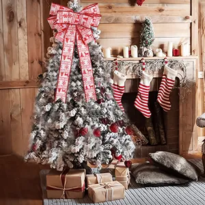 Large handmade Christmas bow tree topper with red reindeer and snowflake patterns