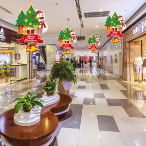 Vibrant Merry Christmas hanging ceiling decorations featuring colorful snowman and trees in a mall