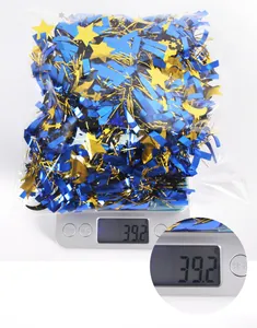 Blue and gold star moon tinsel garland shown on a scale weighing exactly 39.2 grams