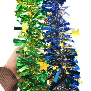 Close-up of blue and green star tinsel garlands for festive party decorations