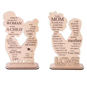 Laser-cut wooden Mother's Day ornaments featuring mother-child silhouettes and quotes