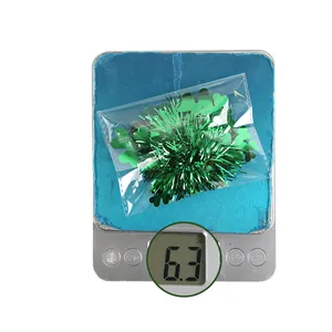 Green tinsel hair clip with clover design for St. Patrick's Day weighing 6.3 grams