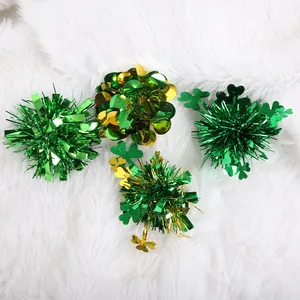 Detailed view of green tinsel and shamrock hair clips for St. Patrick's Day celebration