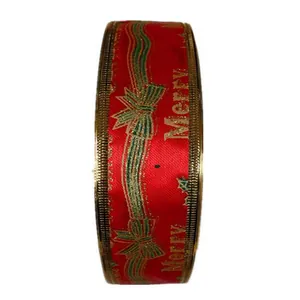Detailed view of 5cm red Christmas grosgrain ribbon with golden Merry text and bow