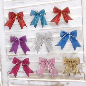 Fiocchi natalizi glitterati in colori assortiti per decorazioni per l'albero e ornamenti