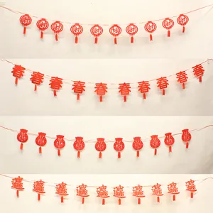Red non-woven Chinese New Year banners with festive characters for holiday decoration