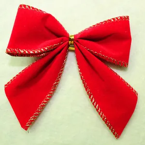 Red velvet Christmas bow decoration with elegant gold stitched edges for tree decor