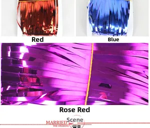 Detail of thickened foil fringe curtains in red, blue, and fuchsia for party backdrops.