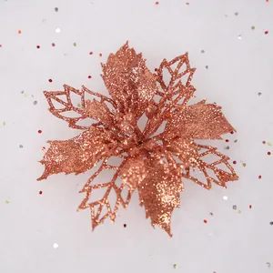 Macro view of a rose gold glitter hollow artificial Christmas poinsettia flower decoration