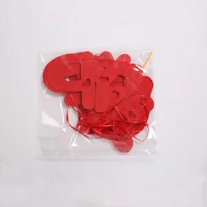Red non-woven Happy New Year banner garland set in clear retail plastic packaging