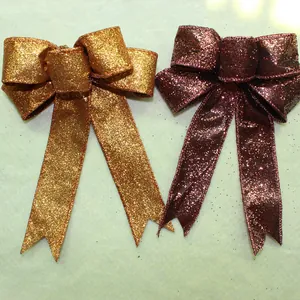Detail of gold and burgundy glitter bows for Christmas tree decoration