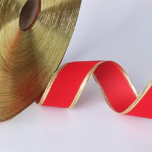 Close-up detail of 3.8cm wide luxury red velvet ribbon with gold edges for Christmas DIY